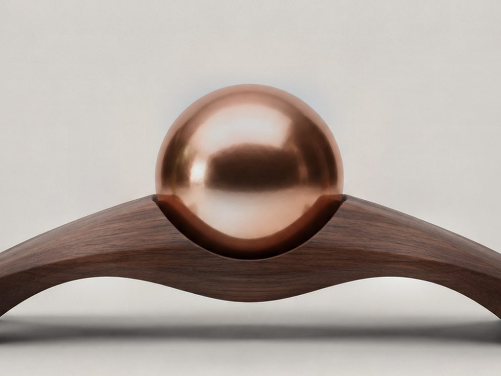 Close view of a copper sphere sunk into its carved seat in the crown of the Span arch