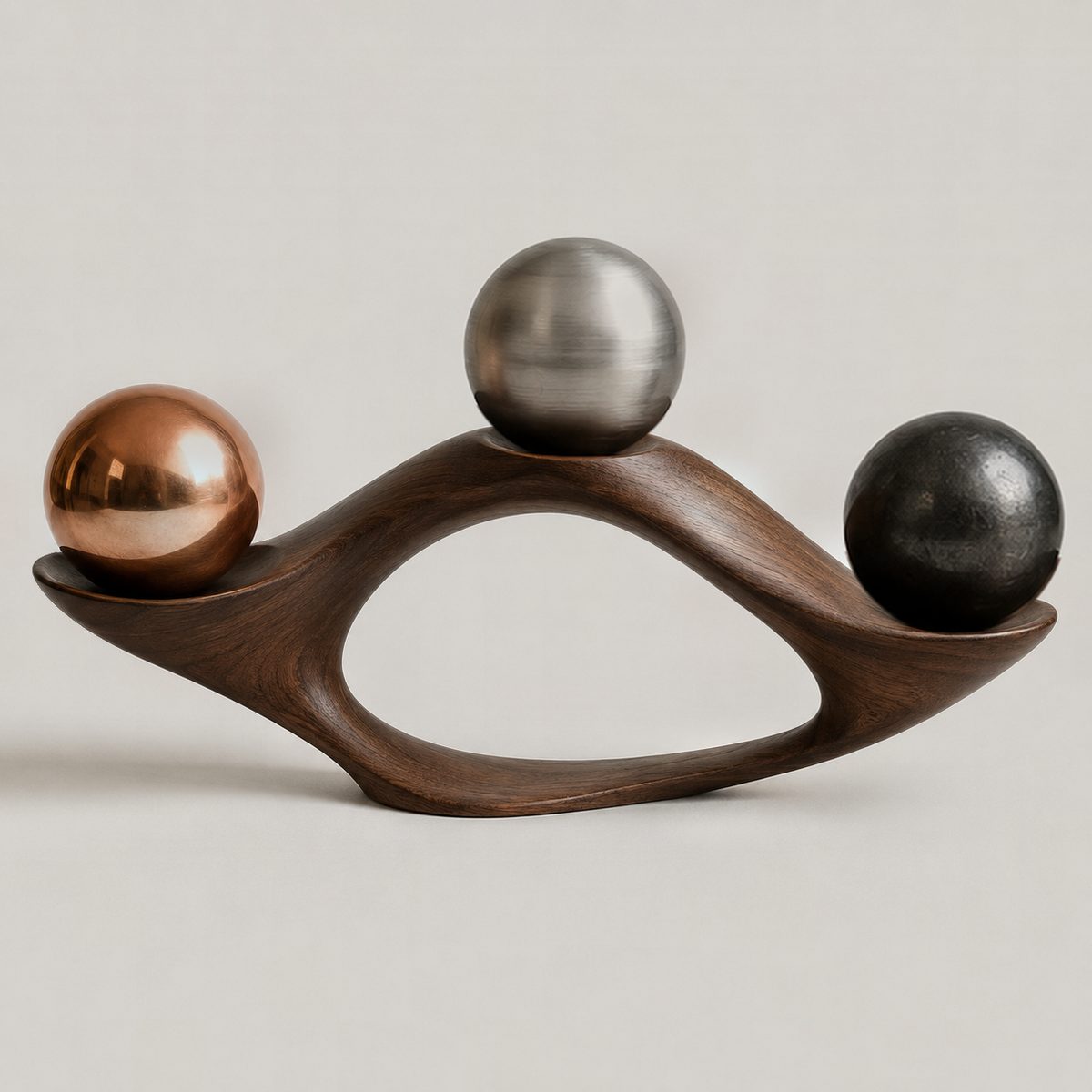 Lens, ARKA III: copper, steel, ceramic spheres resting in seats carved into a walnut form