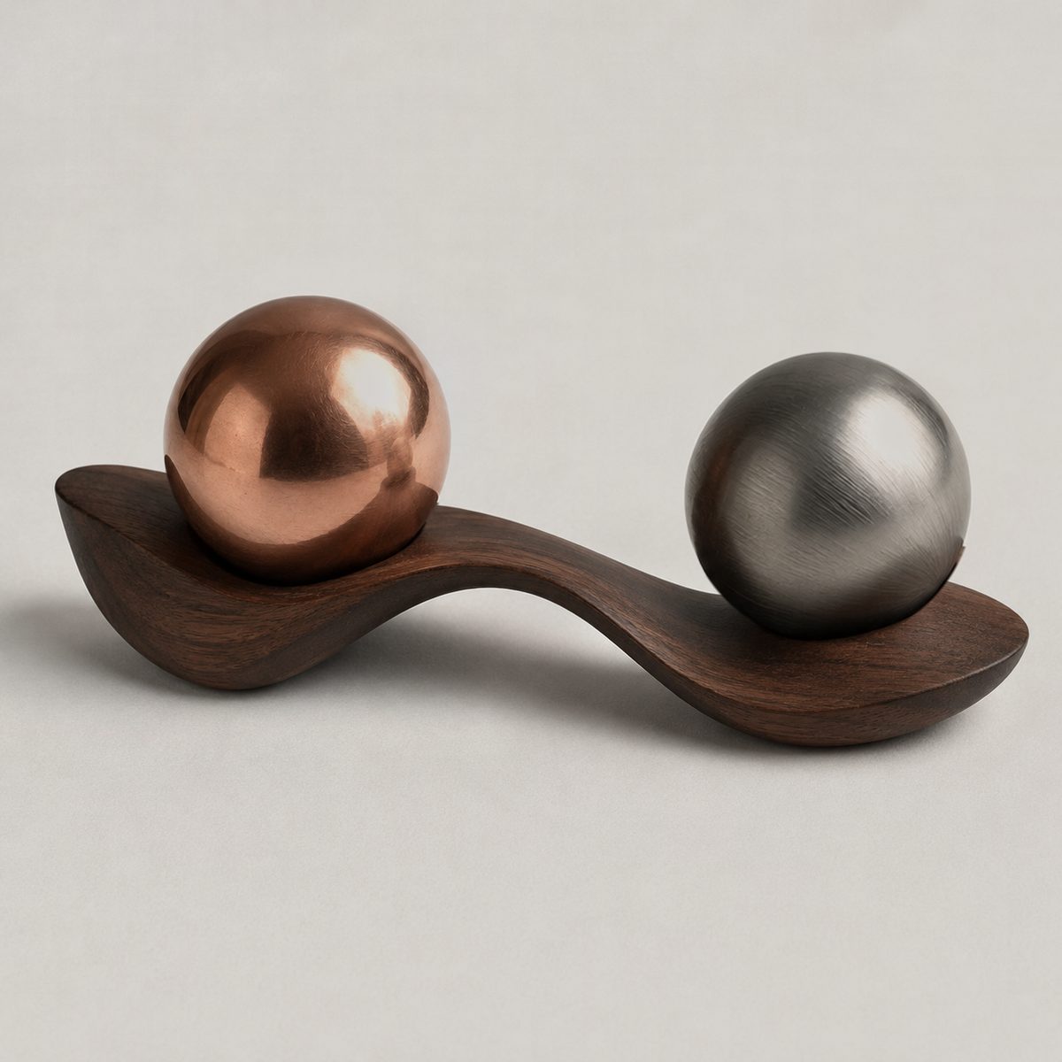 Meander, ARKA II: copper, steel spheres resting in seats carved into a walnut form