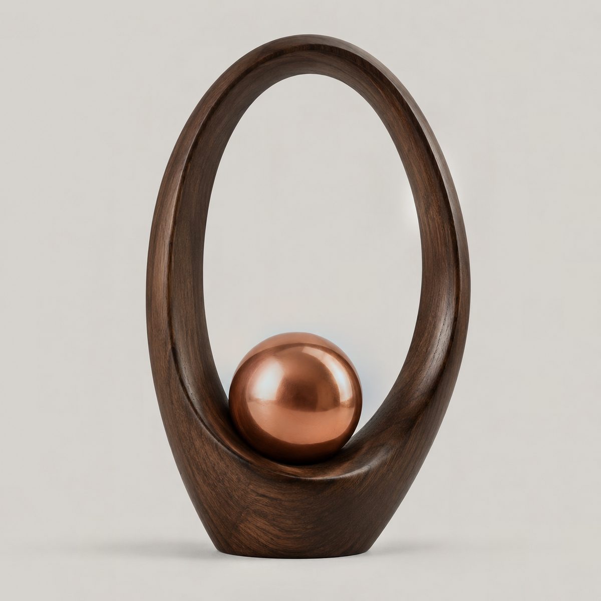 Oculus, ARKA I: 1 × 50 mm copper spheres resting in seats carved into a walnut form